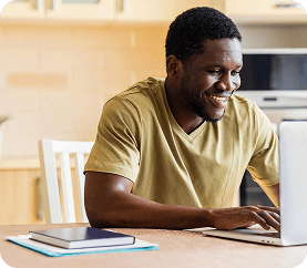 Learner studying at a laptop